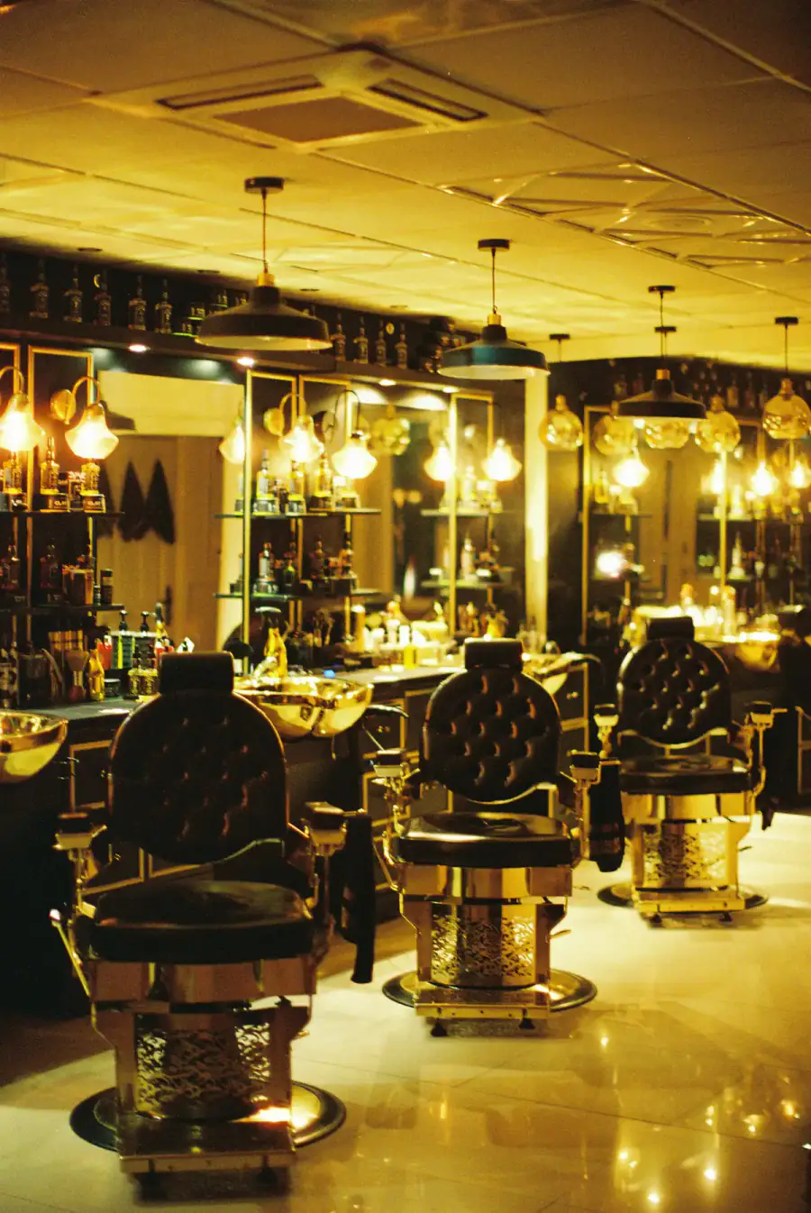 Barber lounge with leather chairs and warm lights